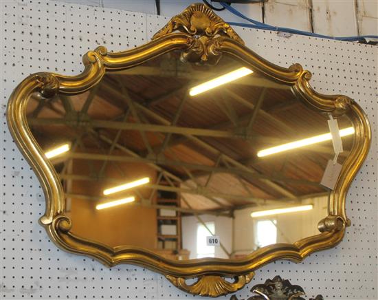 Cartouche shaped gilt framed wall mirror